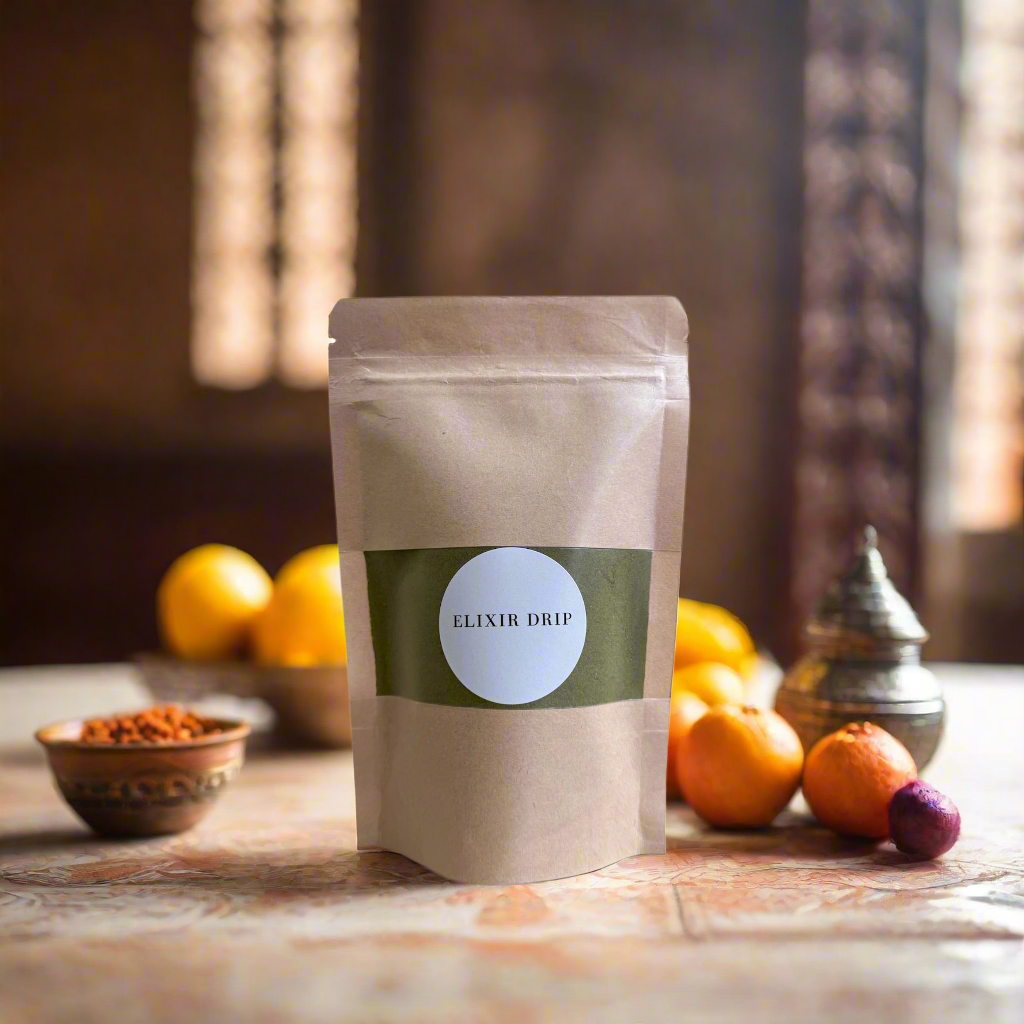 A sealed pouch with a label that reads 'ELIXIR DRIP', containing henna powder.