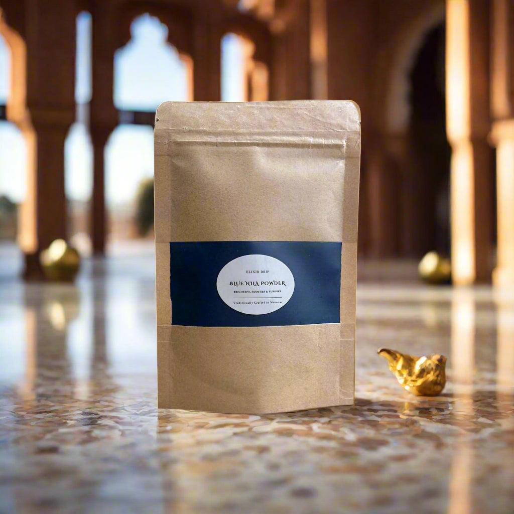 A sealed brown paper pouch with a blue label showing the product name 'Moroccan Blue Nila Powder' and the weight '80g'.