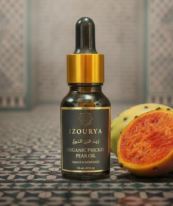 A small amber glass dropper bottle of Zourya Organic Prickly Pear Oil with a gold collar and black label, centered on a plain white background.